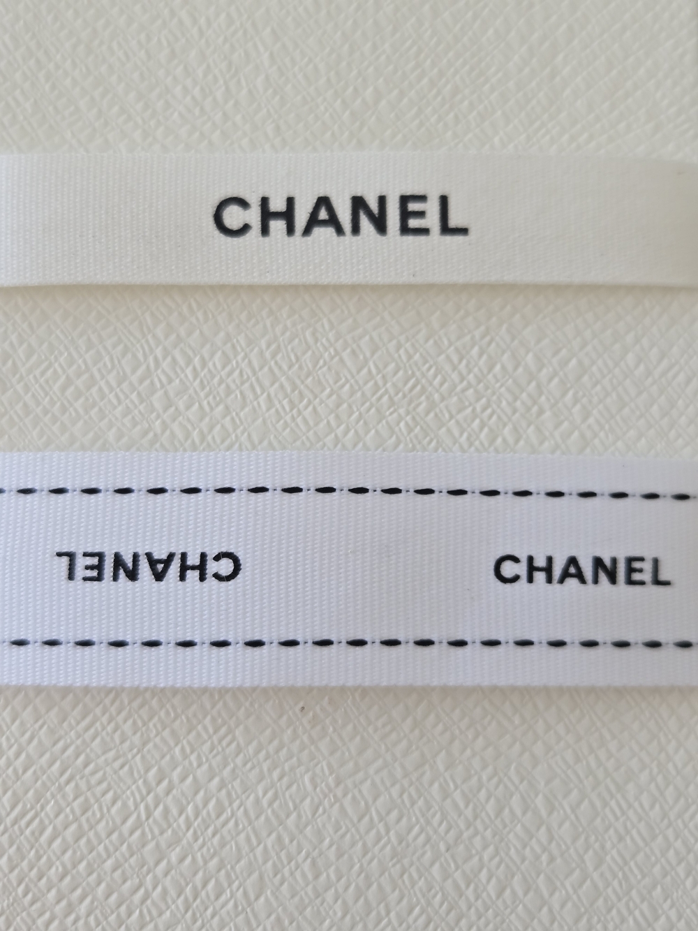 CHANEL White Ribbon with Black Logo Print